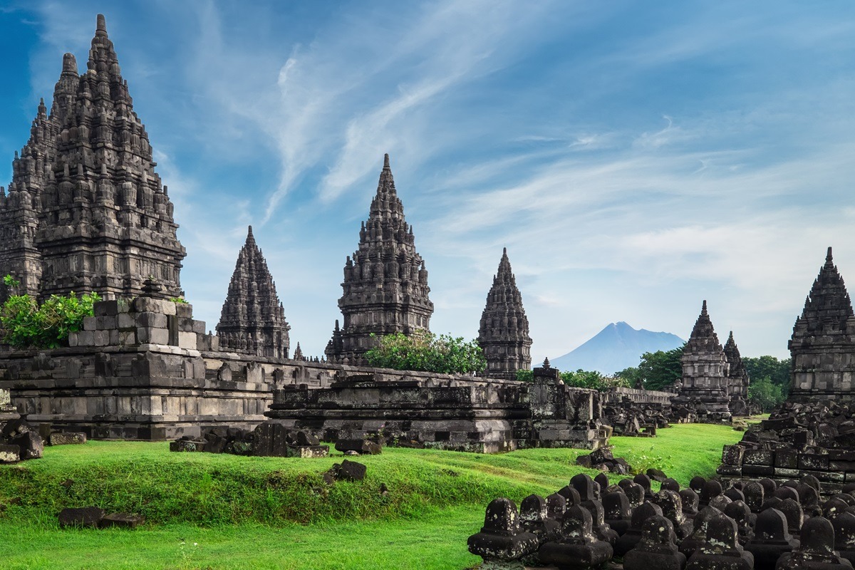Ancient,Stone,Ruins,On,Green,Field,And,Candi,Prambanan,Or