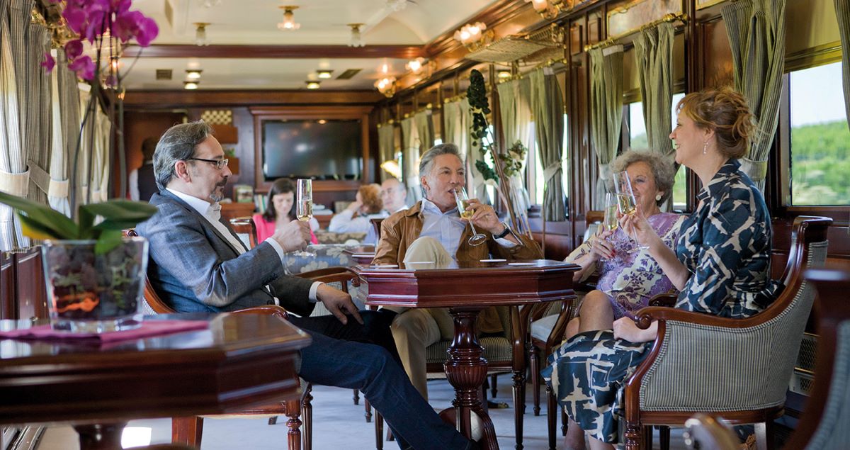 people-drinking-wine-on-luxury-train